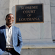 Theo Shaw, standing outside the Louisiana Supreme Court where he clerked for the chief justice, in late 2018.